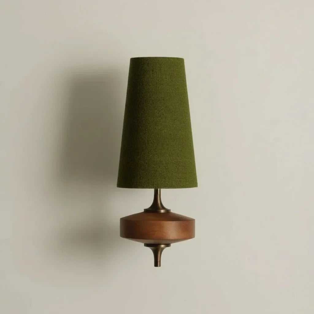 Wall-mounted lamp with a green shade and wooden base on a beige background
