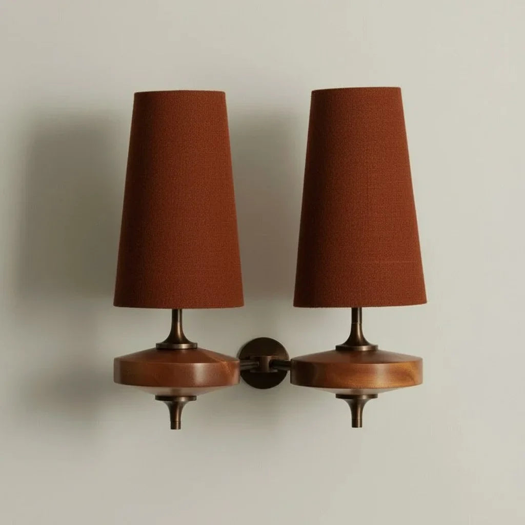 Pair of wall-mounted lamps with brown shades on a neutral background