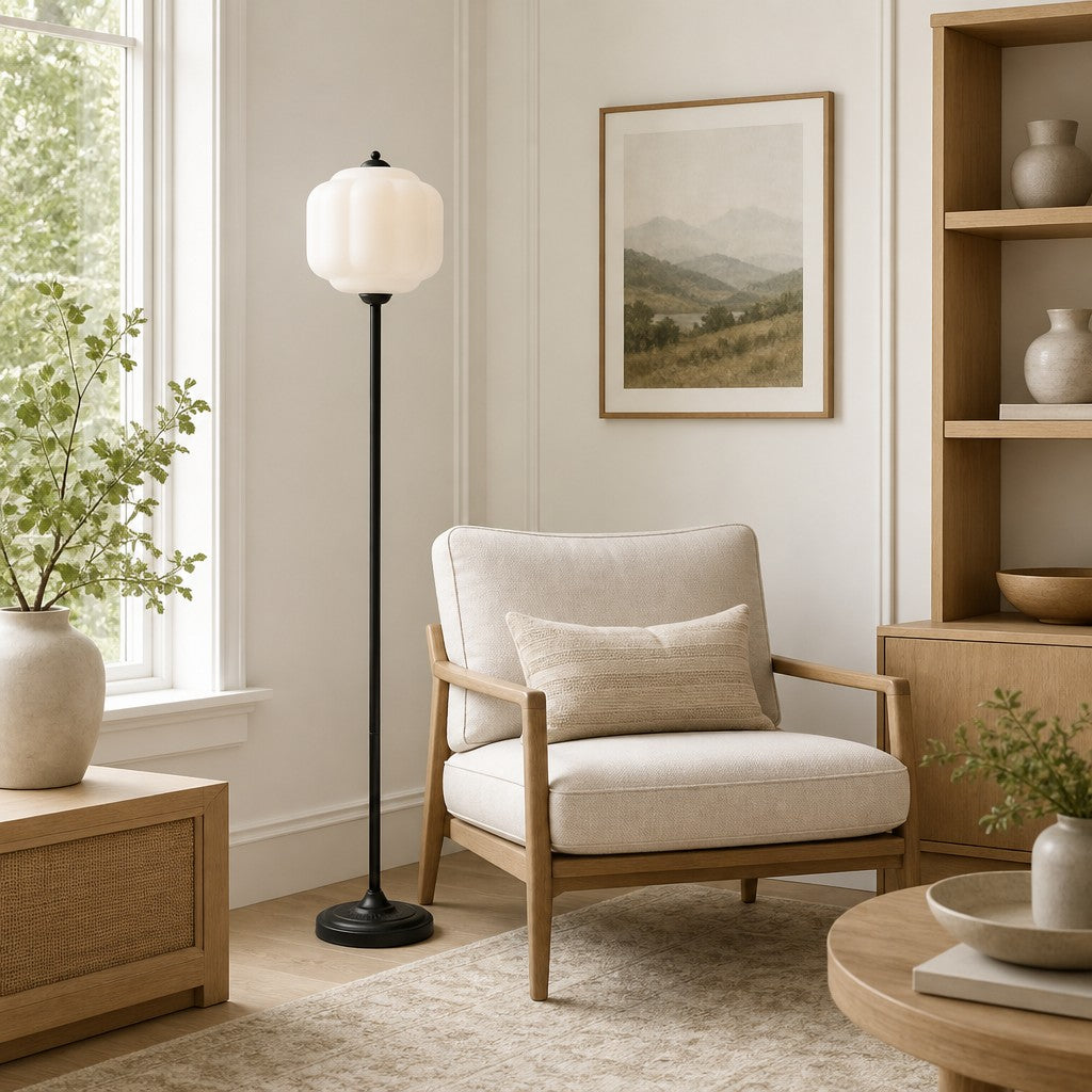 Modern living room with a beige armchair, floor lamp, and decorative items.