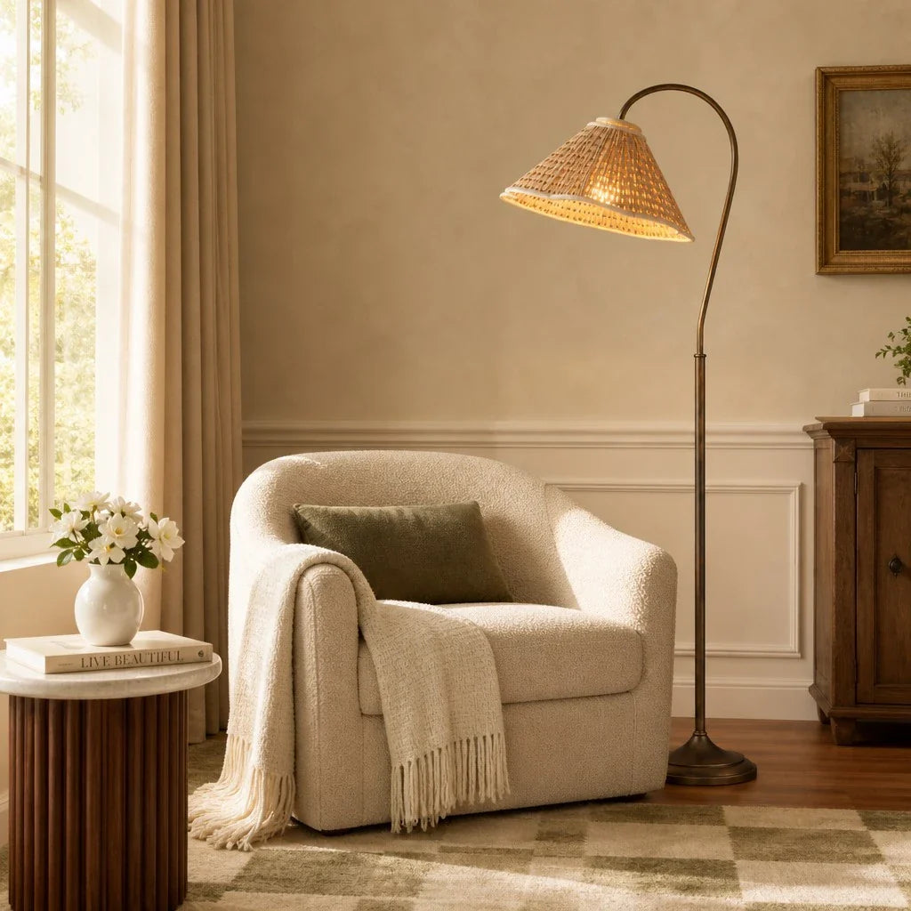 Cozy living room with a beige armchair, lamp, and side table.